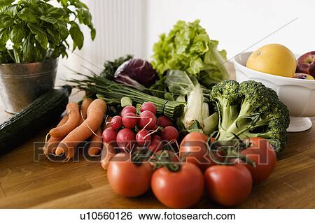 Fresh vegetables on wooden table View Large Photo Image Stock Photograph - Fresh vegetables on wooden table. Fotosearch