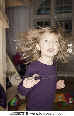 Girl dancing in bedroom View Large Photo Image Stock Photo - Girl dancing in bedroom. Fotosearch