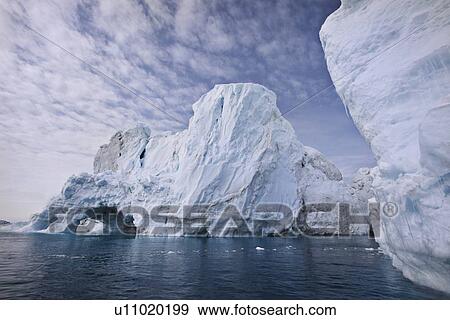 Stock Photo - Glaciers under cloudy sky. Fotosearch
