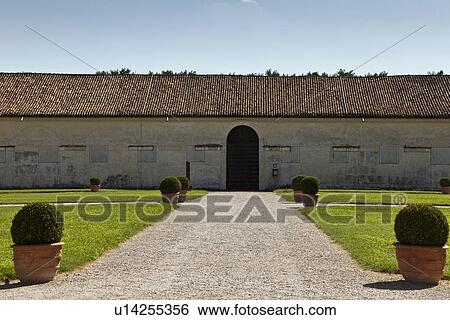 Stock Photograph - Gravel path and manicured gardens. Fotosearch