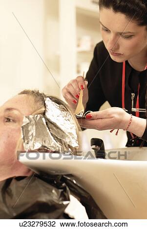 Hair stylist coloring clients hair View Large Photo Image Stock Image - Hair stylist coloring clients hair. Fotosearch
