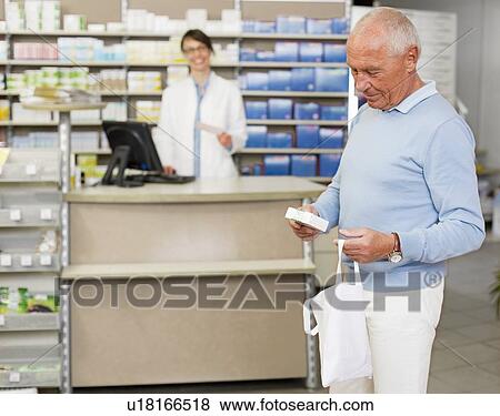 Man picking up prescription at pharmacy View Large Photo Image Stock Photo - Man picking up prescription at pharmacy. Fotosearch