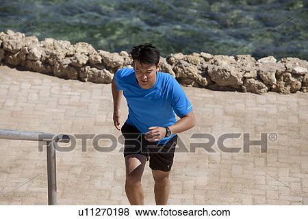 Man running up steps outdoors View Large Photo Image Stock Photo - Man running up steps outdoors. Fotosearch