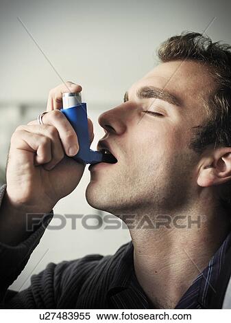 Man using asthma inhaler View Large Photo Image Stock Photography - Man using asthma inhaler. Fotosearch