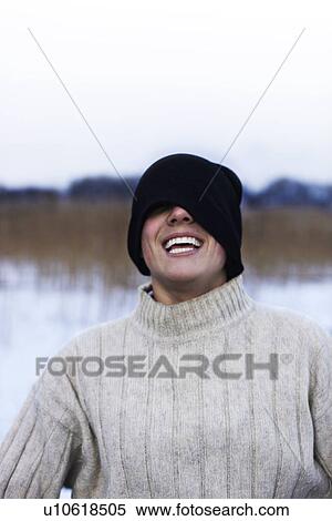 Man wearing hat over eyes in snow View Large Photo Image Stock Photography - Man wearing hat over eyes in snow. Fotosearch