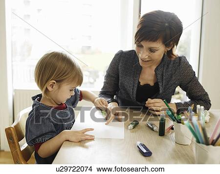 Mother and daughter drawing together View Large Photo Image Picture - Mother and daughter drawing together. Fotosearch