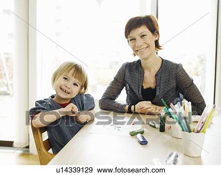Stock Photo - Mother and daughter drawing together. Fotosearch