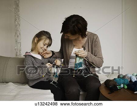 Mother and daughter knitting together View Large Photo Image Stock Photo - Mother and daughter knitting together. Fotosearch