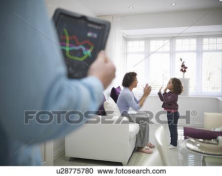 Mother and daughter playing together View Large Photo Image Stock Image - Mother and daughter playing together. Fotosearch