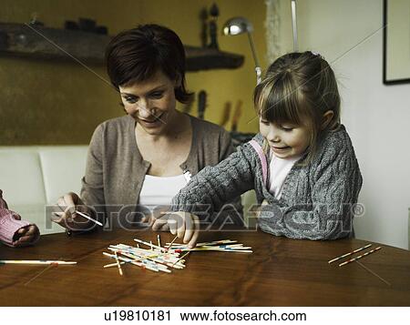 Mother and daughters playing together View Large Photo Image Stock Image - Mother and daughters playing together. Fotosearch