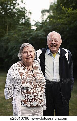 Stock Photograph - Older couple smiling together outdoors. Fotosearch