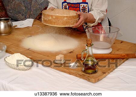 Older woman baking in living room View Large Photo Image Stock Photograph - Older woman baking in living room. Fotosearch