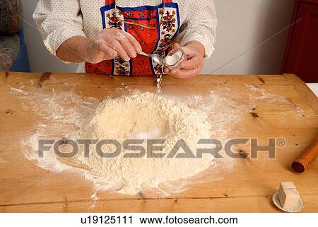 Older woman baking on wooden board View Large Photo Image Stock Image - Older woman baking on wooden board. Fotosearch