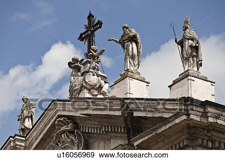 Ornate statues on roof of building View Large Photo Image Stock Photo - Ornate statues on roof of building. Fotosearch
