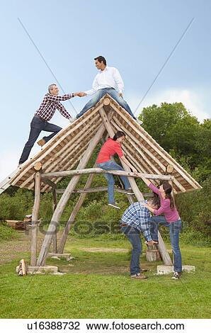 People climbing log hut outdoors View Large Photo Image Stock Image - People climbing log hut outdoors. Fotosearch