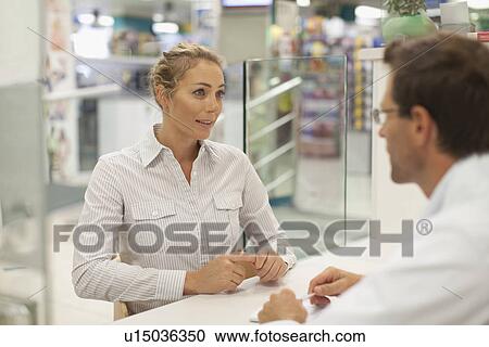 Pharmacist consulting with patient View Large Photo Image Stock Image - Pharmacist consulting with patient. Fotosearch
