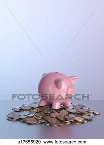 Piggy bank on pile of coins View Large Photo Image Stock Image - Piggy bank on pile of coins. Fotosearch
