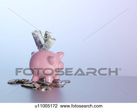Piggy bank with money on table View Large Photo Image Stock Image - Piggy bank with money on table. Fotosearch