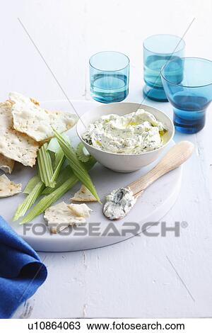 Stock Image - Plate of cheese, crackers and celery. Fotosearch