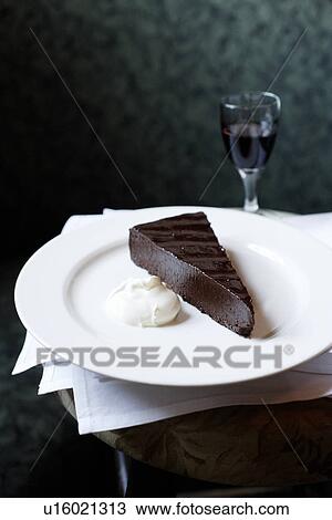 Plate of chocolate cake with whip cream View Large Photo Image Stock Image - Plate of chocolate cake with whip cream. Fotosearch