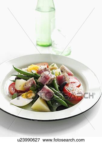 Stock Photo - Plate of summer fruit salad with tuna. Fotosearch