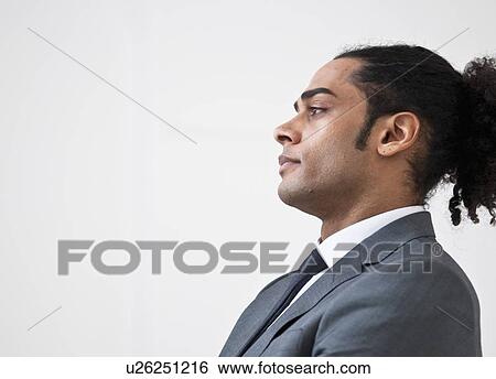 Stock Photograph - Profile of businessmans face. Fotosearch
