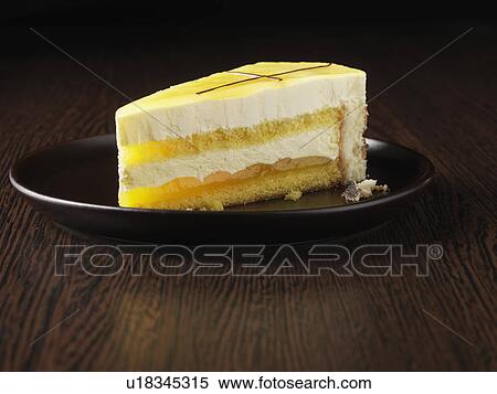 Stock Photography - Slice of Cointreau gateau on plate. Fotosearch