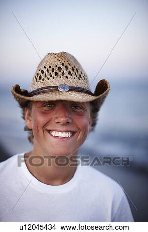 Picture - Smiling boy on beach. Fotosearch