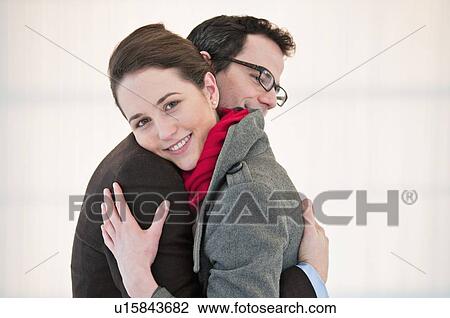 Smiling couple hugging View Large Photo Image Stock Image - Smiling couple hugging. Fotosearch