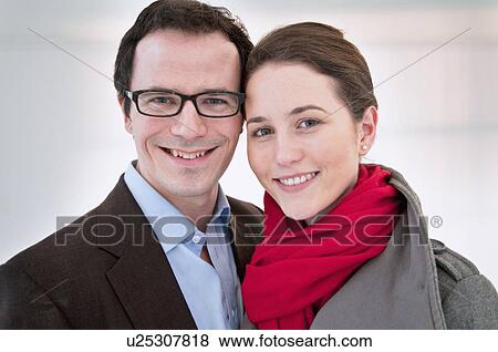 Stock Photo - Smiling couple hugging. Fotosearch