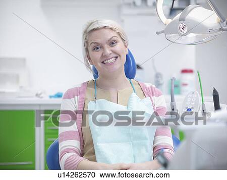 Smiling woman in dentists chair View Large Photo Image Stock Image - Smiling woman in dentists chair. Fotosearch