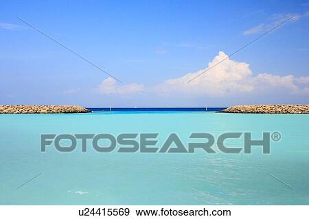 Stock Photo - Stone walls on tropical waters. Fotosearch