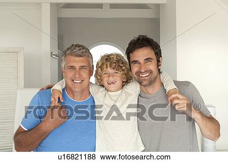 Stock Photo - Three generations of men hugging. Fotosearch
