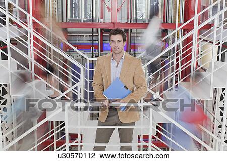 Stock Image - Time lapse of business people on stairs. Fotosearch