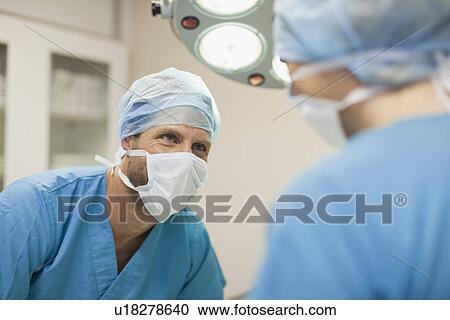 Stock Image - Veterinary surgeons working together. Fotosearch