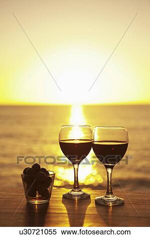 Wine glasses and grapes outdoors View Large Photo Image Stock Photography - Wine glasses and grapes outdoors. Fotosearch