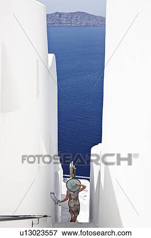 Stock Photo - Woman admiring ocean view. Fotosearch