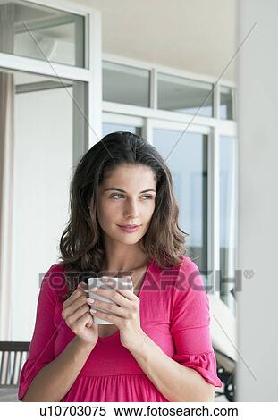 Woman drinking cup of coffee outdoors View Large Photo Image Stock Photography - Woman drinking cup of coffee outdoors. Fotosearch