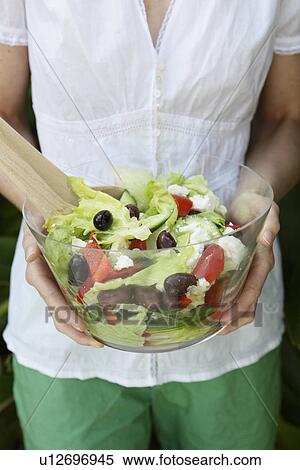 Woman holding bowl of salad View Large Photo Image Stock Photography - Woman holding bowl of salad. Fotosearch