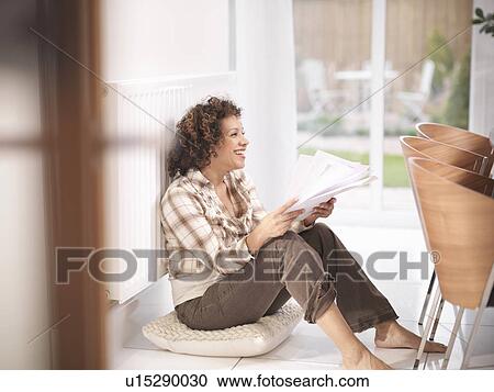 Woman leaning against radiator View Large Photo Image Stock Image - Woman leaning against radiator. Fotosearch
