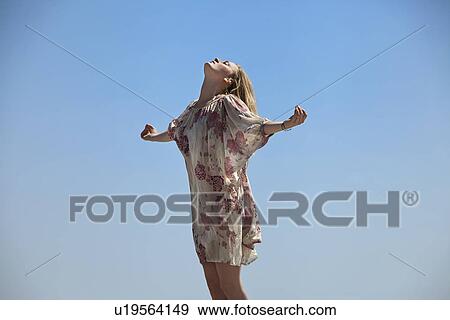 Stock Photo - Woman meditating outdoors. Fotosearch