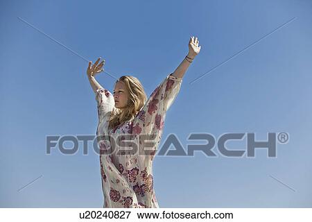 Woman stretching outdoors View Large Photo Image Stock Photo - Woman stretching outdoors. Fotosearch