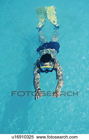 Woman swimming in snorkel and fins View Large Photo Image Stock Photography - Woman swimming in snorkel and fins. Fotosearch