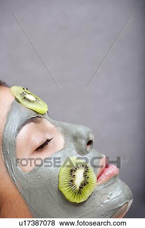 Woman with skin mask and kiwi in bath View Large Photo Image Stock Photo - Woman with skin mask and kiwi in bath. Fotosearch