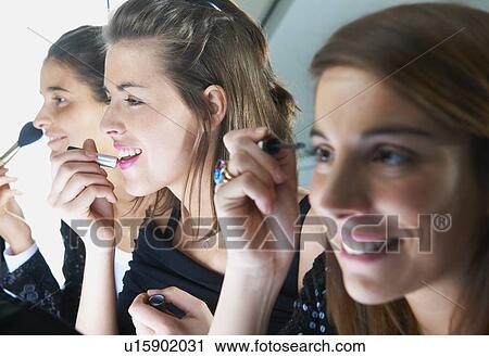 Women applying make up together View Large Photo Image Stock Image - Women applying make up together. Fotosearch