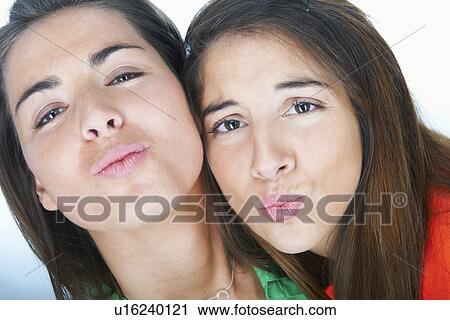 Women making kissy faces together View Large Photo Image Stock Image - Women making kissy faces together. Fotosearch