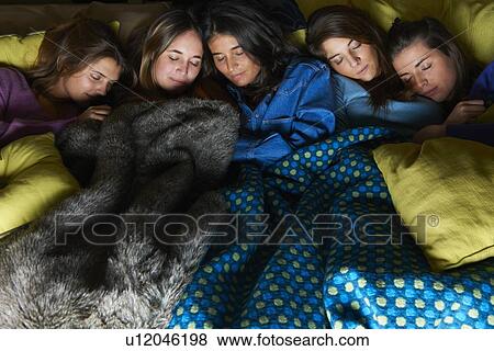 Stock Photo - Women sleeping in bed together. Fotosearch
