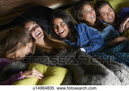 Women watching television together View Large Photo Image Stock Photography - Women watching television together. Fotosearch