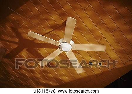 Wooden ceiling fan casting shadows View Large Photo Image Stock Image - Wooden ceiling fan casting shadows. Fotosearch
