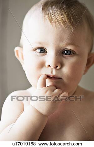 Baby girl sucking her finger View Large Photo Image Stock Photo - Baby girl sucking her finger. Fotosearch